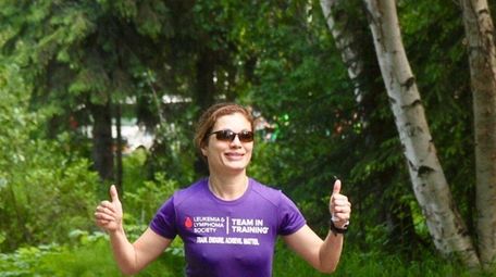 Giving her family and friends the thumbs-up sign,