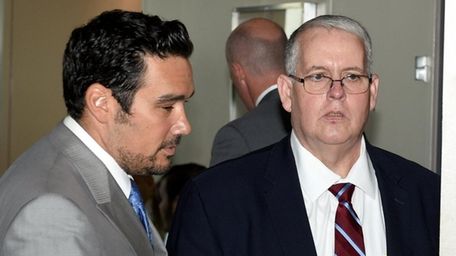 John Carney, right, former Islip Public Safety commissioner,