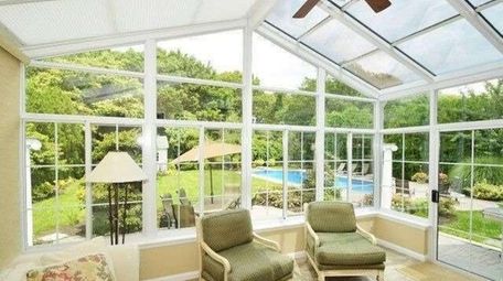 The four-seasons room in the Nesconset Colonial, priced