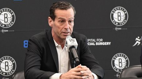 Nets head coach Kenny Atkinson answers questions from