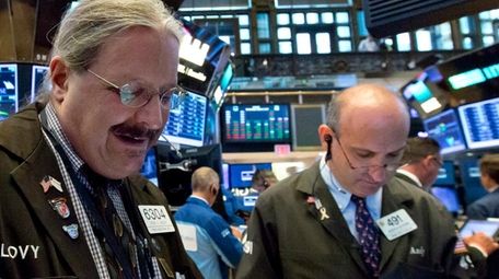 Traders Steve Lovejoy, left, and Andrew Silverman at