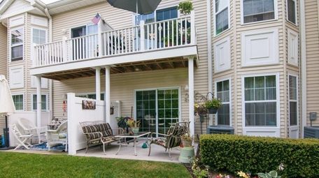 The first-floor unit, with finished basement, is listed