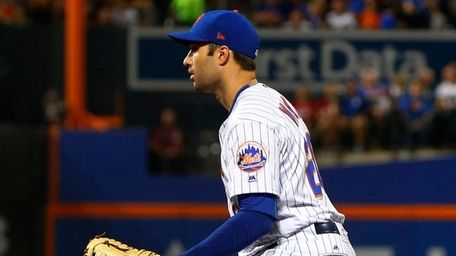 Neil Walker of the New York Mets defends