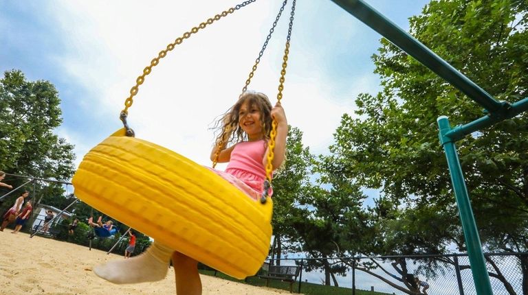 Lyra Prestia, 6, of Centerport, plays at a