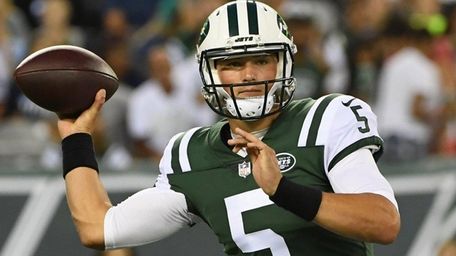 Jets quarterback Christian Hackenberg passes the football against