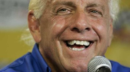 Wrestler Ric Flair addresses the media during a