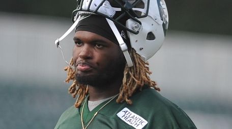 Lorenzo Mauldin #55 heads off the field after