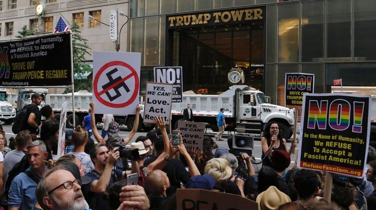 Demonstrators gather near Trump Tower in Manhattan to