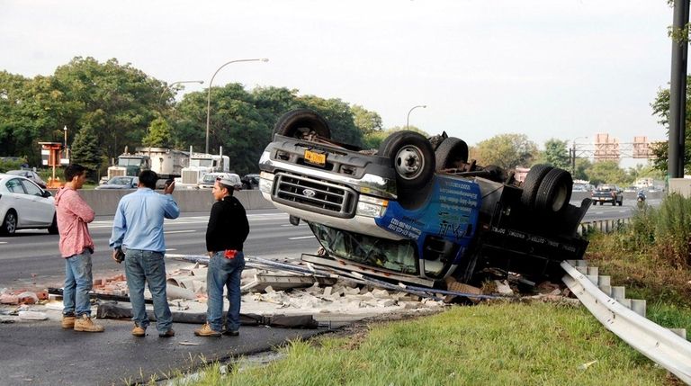 An overturned truck is seen after a crash