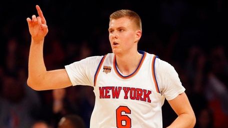 Knicks forward Kristaps Porzingis reacts after hitting a