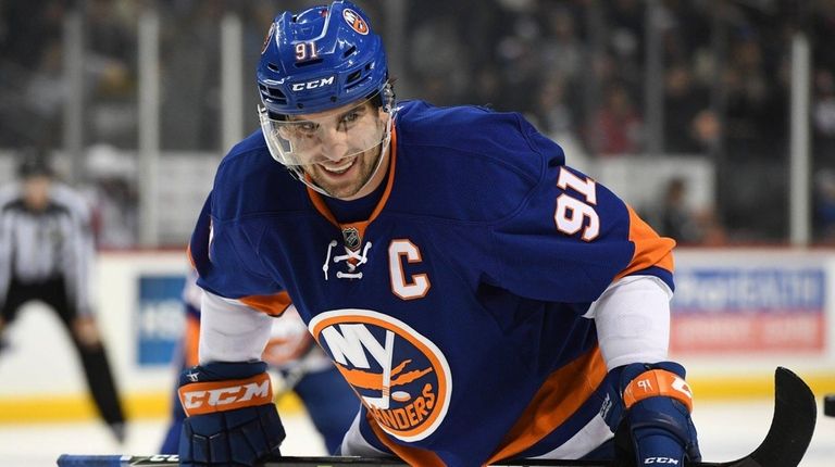 Islanders center John Tavares looks on before a