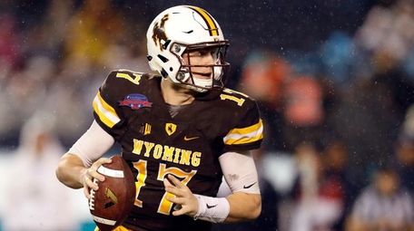 Wyoming quarterback Josh Allen looks to throw the