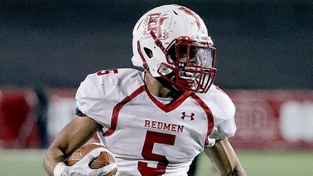 East Islip running back Justin Taveras runs for