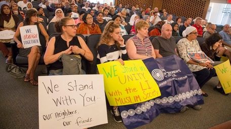 Community members show their support as the Hempstead