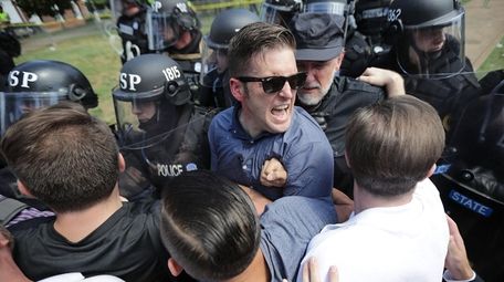 White nationalist Richard Spencer, center, and his supporters