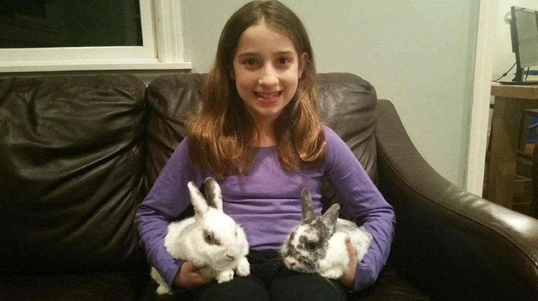 Kidsday reporter Amaya Cigliano with her rabbits, Alfie,