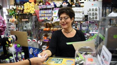 Suzanne Feynman of Brentwood buys Powerball tickets at