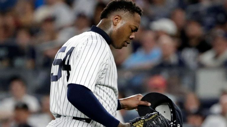 Aroldis Chapman reacts after he was taken out