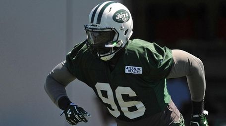 Muhammad Wilkerson of the Jets works on fumble recovery drills