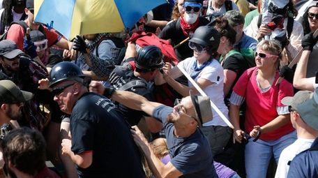 White nationalist demonstrators clash with counterdemonstrators at the