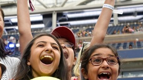 Serena Sharna, 10, left, and her sister, Riya,