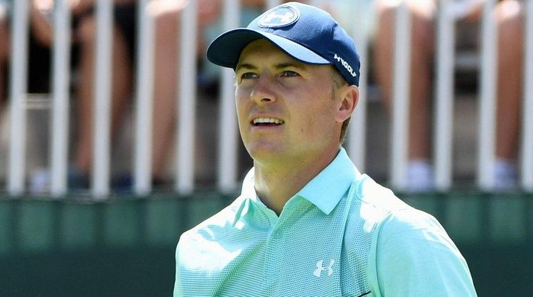 Jordan Spieth watches his tee shot from the