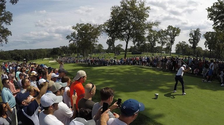 Jordan Spieth plays his shot from the