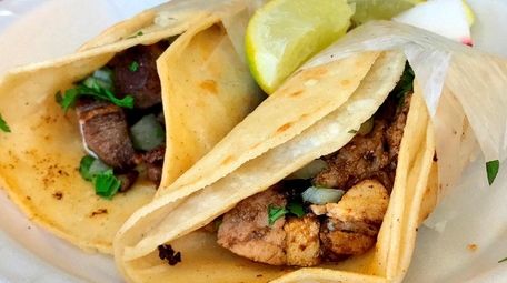 Mexican tacos (here, lengua, left, and al pastor)