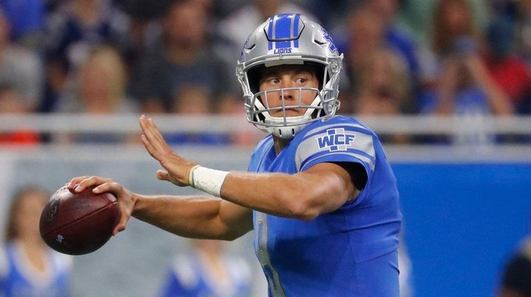Lions quarterback Matthew Stafford looks downfield during the first