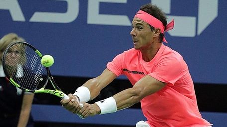 Rafael Nadal with the backhand return against Dusan