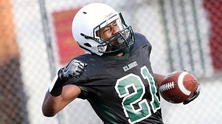 Elmont's Michael Djalo scores the winning TD during