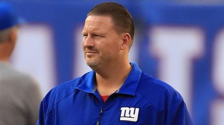 Giants head coach Ben McAdoo watches the team