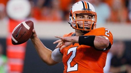 Oklahoma State quarterback Mason Rudolph passes during the