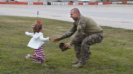 Ella Brucculeri, 3, welcomes her father, Master Sgt.