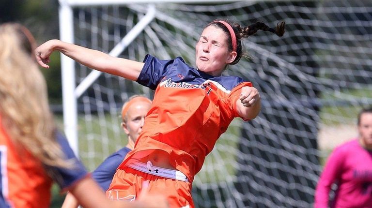 Manhasset's Olivia Wesch heads the ball on Sept.