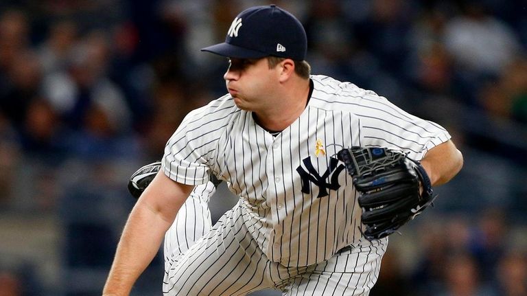 Yankees pitcher Adam Warren delivers against the Boston Red