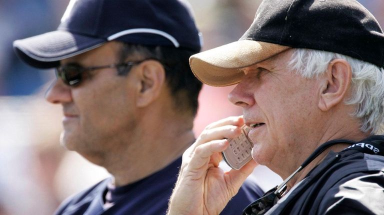 Yankees scout Gene Michael, right, watches batting practice with