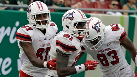 Stony Brook running back Stacey Bedell celebrates with
