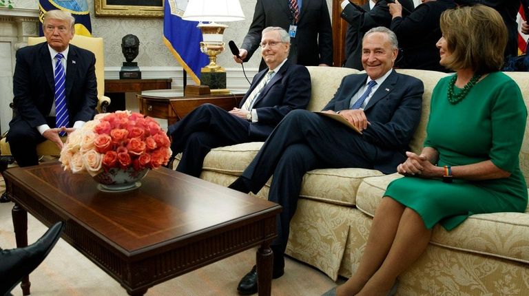President Donald Trump pauses during a meeting last