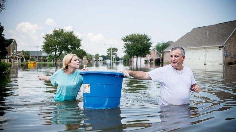 Jenna Fountain and her father, Kevin, carry a
