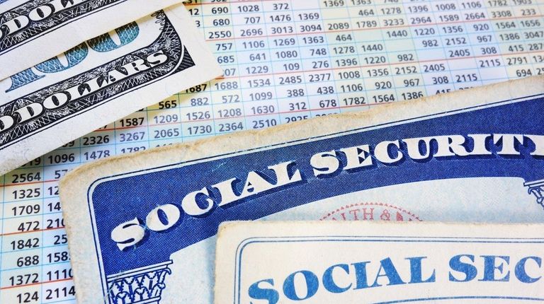 Social Security cards with cash and benefit amount