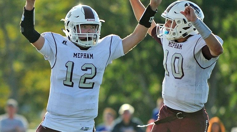 Mepham's Kevin McCleneghan, left, and Michael Proios react after combining