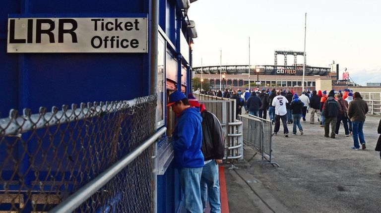 Baseball fans walk from the Mets-Willets Point LIRR