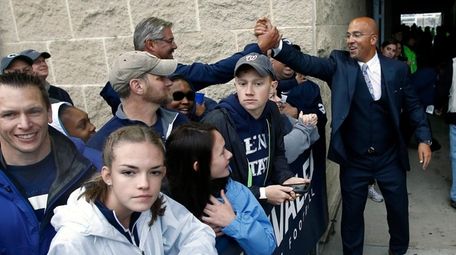 Penn State head coach James Franklin, right, shakes
