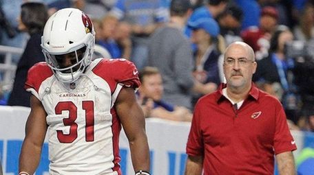 Cardinals running back David Johnson walks off the