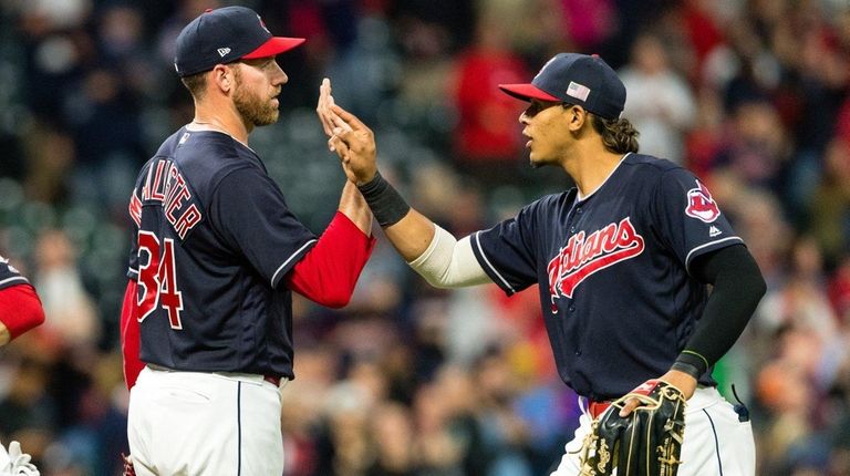 Indians closer Zach McAllister celebrates with Erik Gonzalez