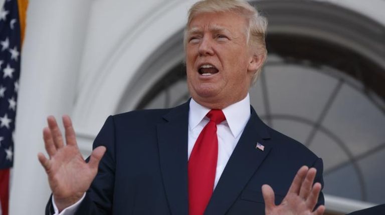 President Donald Trump speaks to reporters on Thursday,