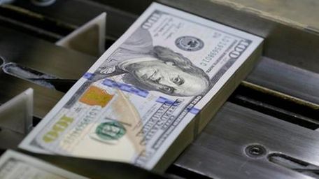 A just-cut stack of $100 bills at the