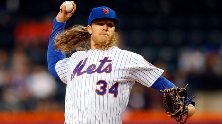Noah Syndergaard of the Mets pitches in the