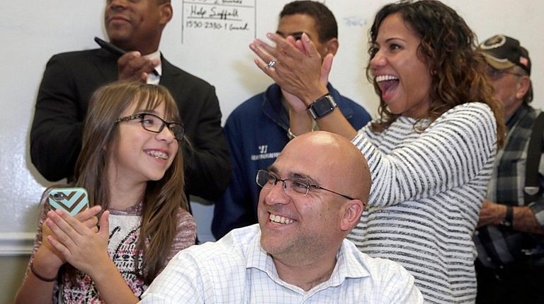 Candidate Larry Zacarese is flanked by daughter Lourdes,
